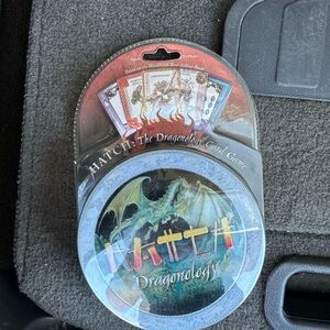 Hatch Dragonology Tin with Red and Green Dragon Artwork